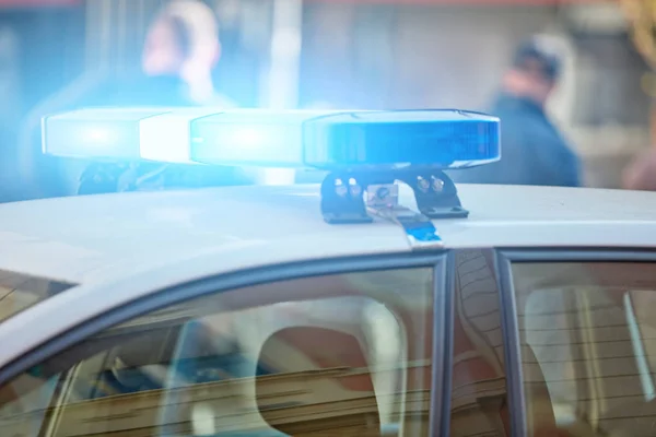 Police car with blue lights on the crime scene in traffic / urba — Stock Photo, Image