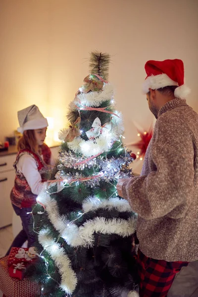 Father and daughter enjoying at Christmas  / New Year's time. — Stock Photo, Image