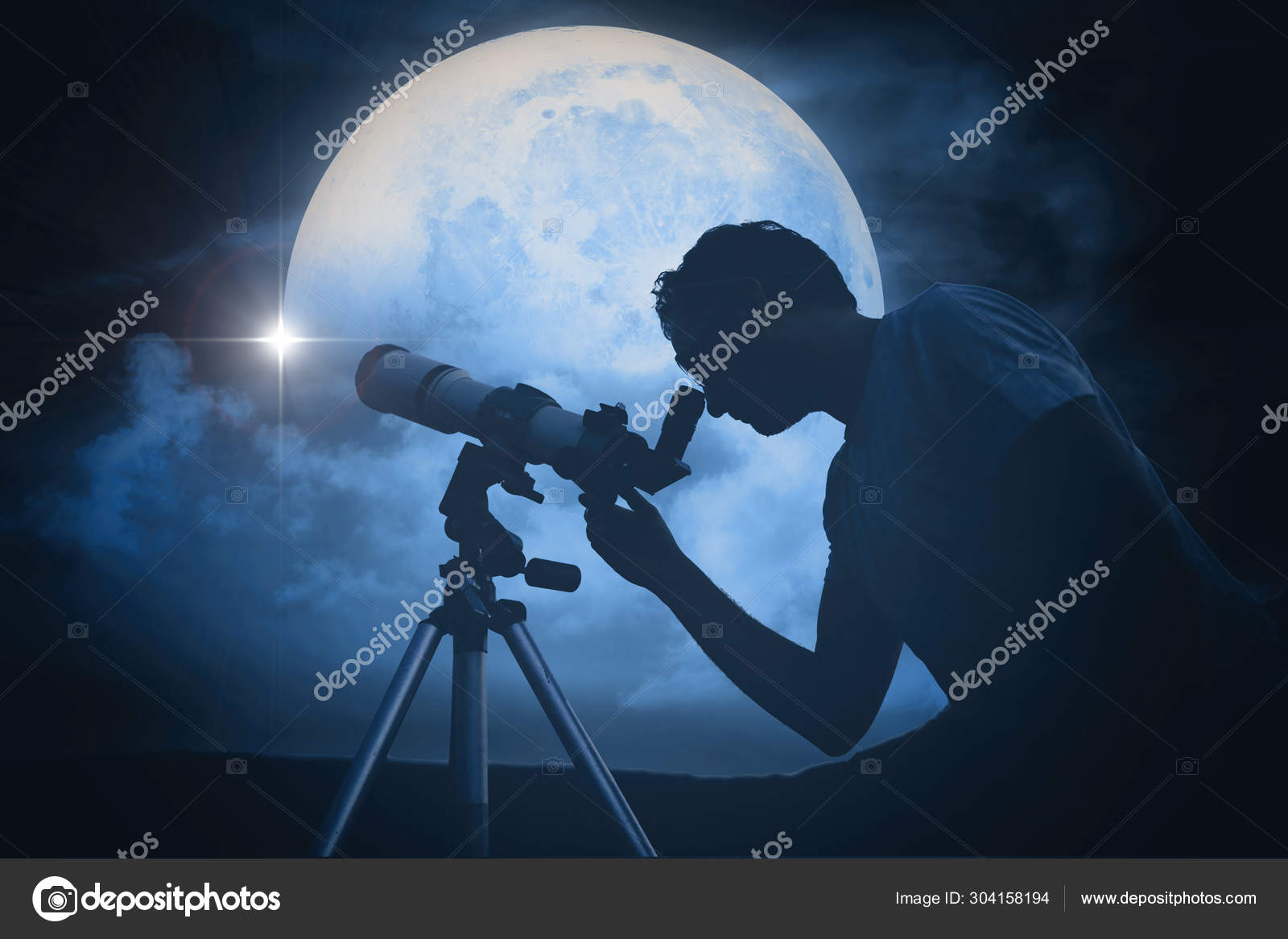 Astronomer with a telescope watching at the stars and Moon. My a Stock