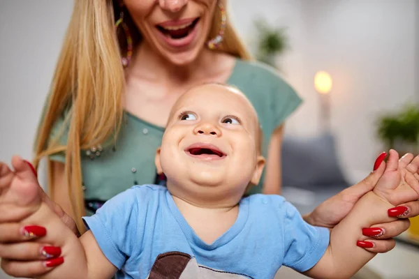 Single mother playing with her baby son. — Stock Photo, Image