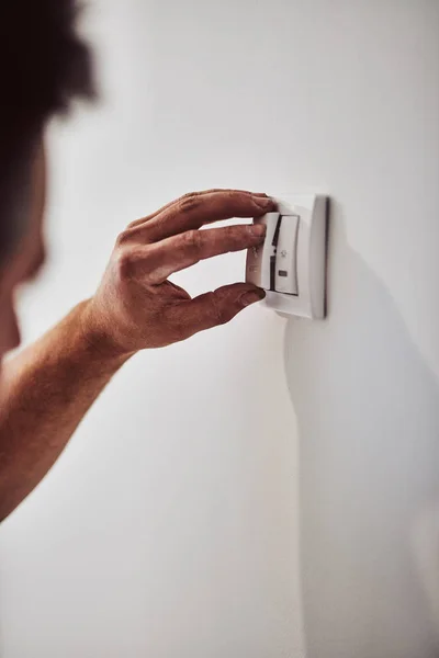 Electrician repairing / fixing wires in the wall.