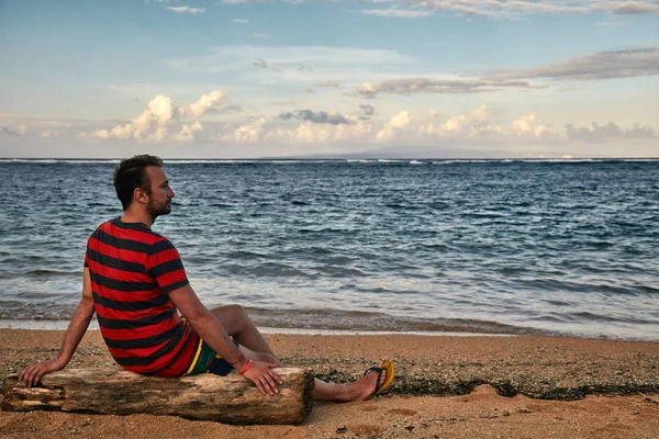 Man enjoying on a deserted tropical beach.