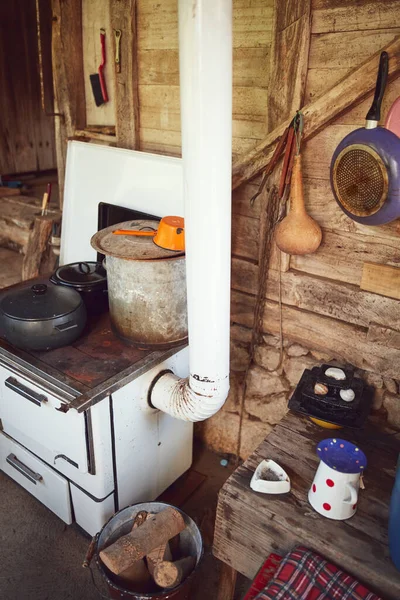 Old stove with pots used for cooking food on a traditional old way.