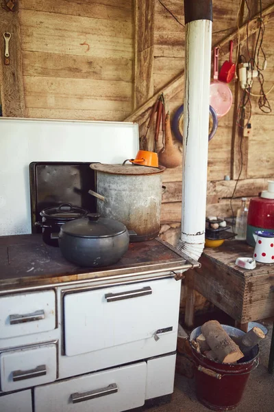 Old stove with pots used for cooking food on a traditional old way.