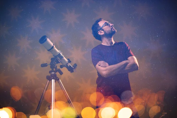 Amateur astronomer looking at the stars with a telescope. Astronomy and astrology concept.