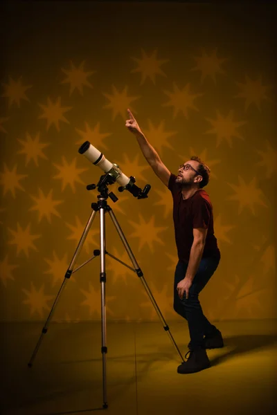 Amateur astronomer looking at the stars with a telescope. Astronomy and astrology concept.