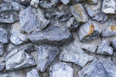 Taş ve çimentodan yapılmış model arka plan duvarı.