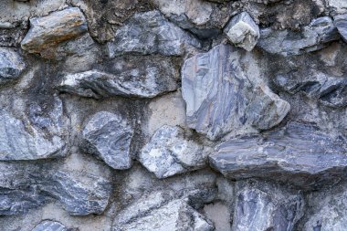 Taş ve çimentodan yapılmış model arka plan duvarı.