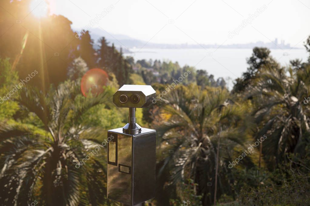 Coin operated turist binocular (telescope ) in forest