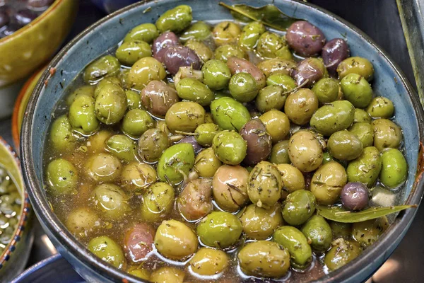 Marinated olives with herbs.