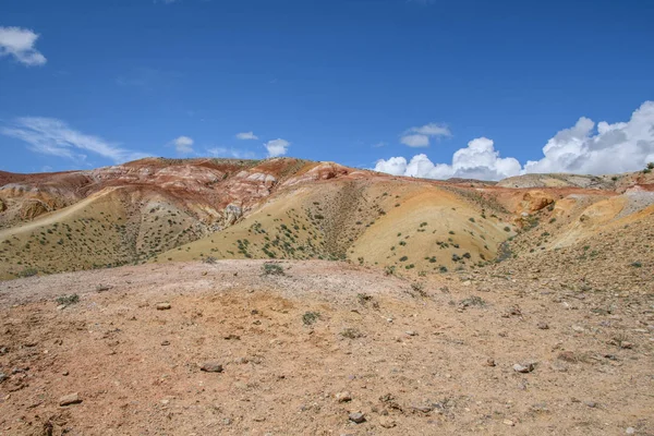 Valley of Mars landscapes in the Altai Mountains. Rainbow mountains. Ground con.tains mercury, that\'s why it looks like Mars planet. Altai. Nature of Siberia, Russia