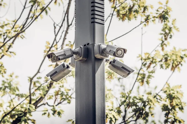 Four security cameras in the park. Public safety. Security camera or CCTV