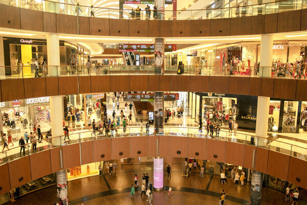 Dubai / UAE - October 19, 2019: World's largest shopping center. Crowd in Dubai Mall. Shoppers in Dubai Mall.