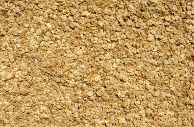 Taze kepekli yulaf arkaplanı. Çiğ yulaf ezmesi arkaplanı. Üst görünüm