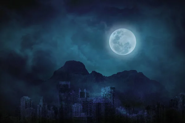 Blue full moon in city abandonment with the mountains and clouds — Stock Photo, Image