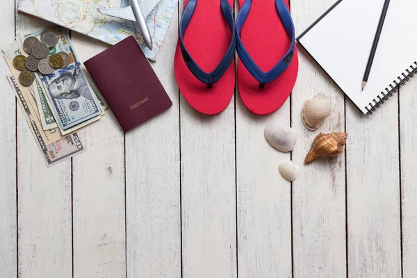 Preparation for travel, money and passport on wooden table,Top view