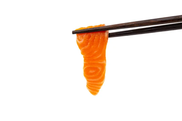 Salmon raw sashimi with chopsticks on a white background — Stock Photo, Image