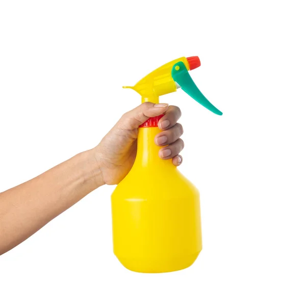 Vrouw hand met een fles spuitwater geïsoleerd op een witte ba — Stockfoto