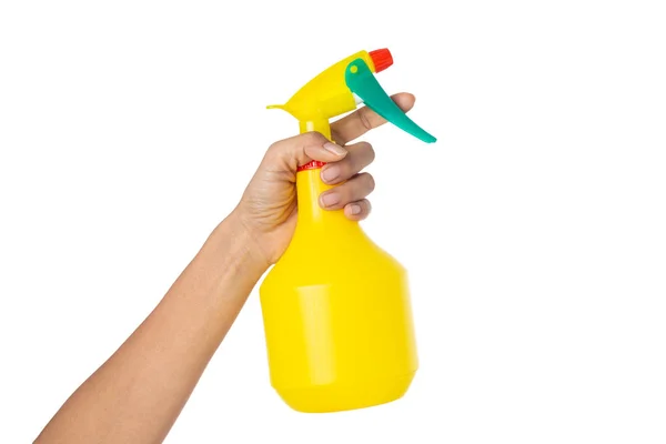 Mulher mão segurando uma garrafa de água pulverizador isolado em um ba branco — Fotografia de Stock