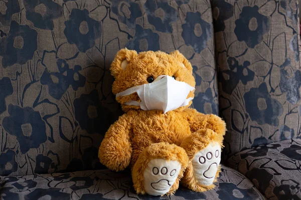 sick teddy bear is wearing a virus protection mask Covid-19 ,Health care concept.