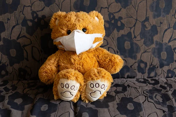 sick teddy bear is wearing a virus protection mask Covid-19 ,Health care concept.