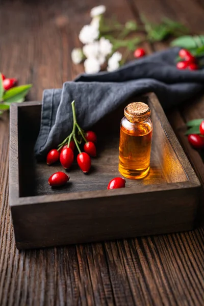 Pure rosehip seed oil in a glass bottle, remedy for skin and hair — Stock Photo, Image