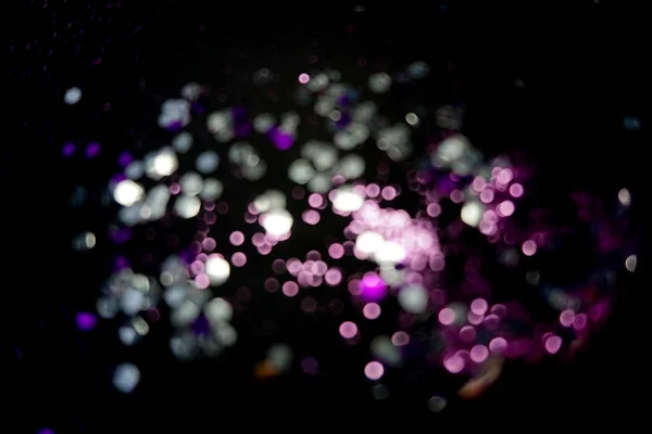 Luces bokeh amarillas y violetas. Fondo de Navidad . — Foto de Stock