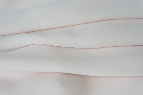 Απαλό κομψό ροζ ύφασμα. Μεταξωτό σατέν. — Φωτογραφία Αρχείου