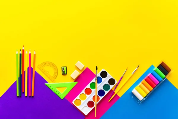 School bright supplies on a yellow background. — Stock Photo, Image