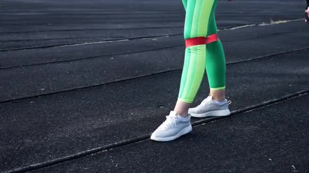 Beautiful Young Girl Green Sports Leggings Engaged Rubber Band Fitness — Stock Video