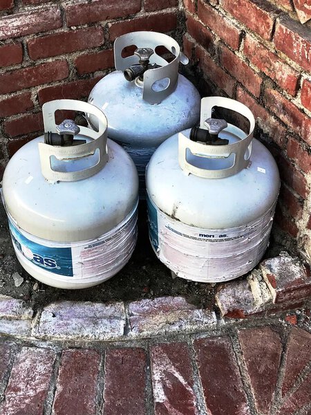 gas tanks lying outside ready to be disposed of.