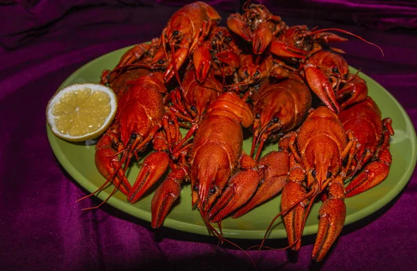 Crayfish on plate with a lemon slice