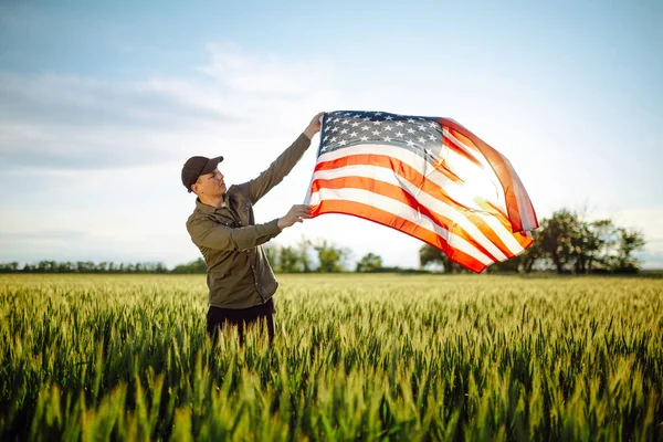 Young Man Wearing Green Shirt Cap Lets American Flag Fly — Stock Photo, Image