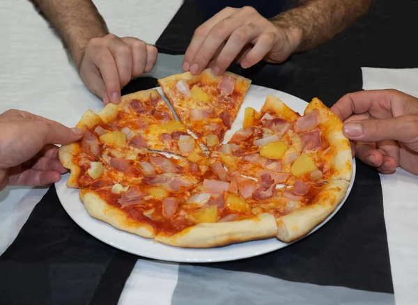 Eating Pizza. Group Of Friends Sharing Pizza Together. People Hands Taking  Slices Of Pepperoni Pizza. Fast Food, Friendship, Leisure, Lifestyle. Stock  Photo