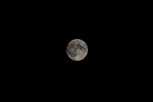 stock image Full moon in black sky picture