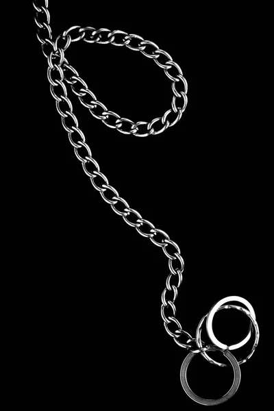 Chain with rings on a black background — Stock Photo, Image