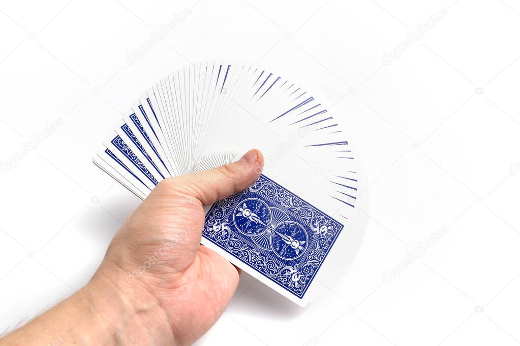 Card fan in hand on a white background isolate