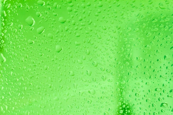Regndroppar Fönsterrutornas Yta Naturligt Mönster Regndroppar Med Gröna Slingor Blå — Stockfoto