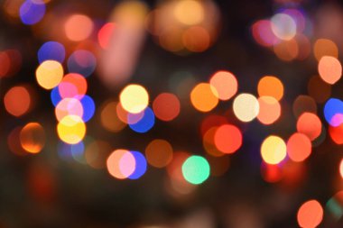 Festive Bokeh arka planda parıldıyor. Işık soyut dokusu