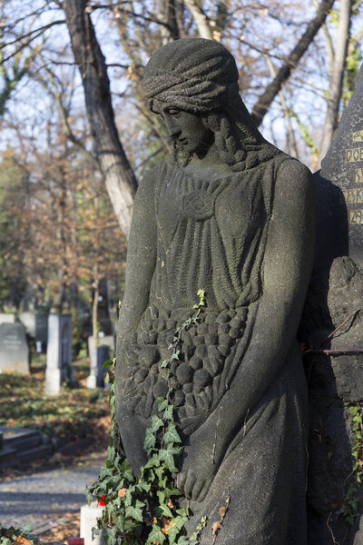 Historic Statue on the mystery old Prague Cemetery, Czech Republic