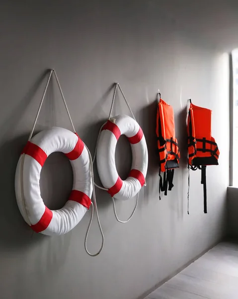 Safety Torus and Life jacket on Gray background.