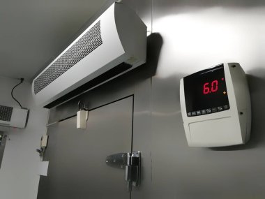 Front of Raw Seafood and Meat Cold storage room with control temperature at 6 celsius degrees clipart