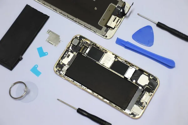 Soft focus to Tools for repairing smart phones on a white background - Change or replacement smart phones battery