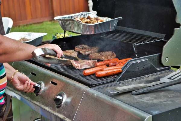 food on the grill at a backyard cookout