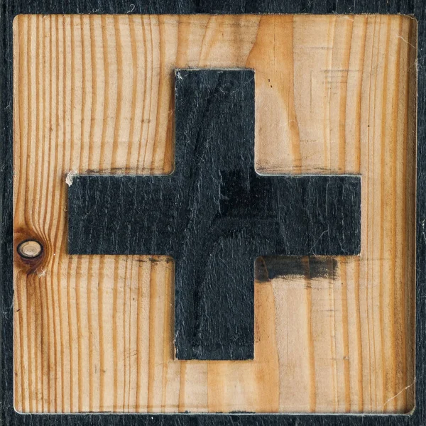 red cross symbol made in wood, to find medical care
