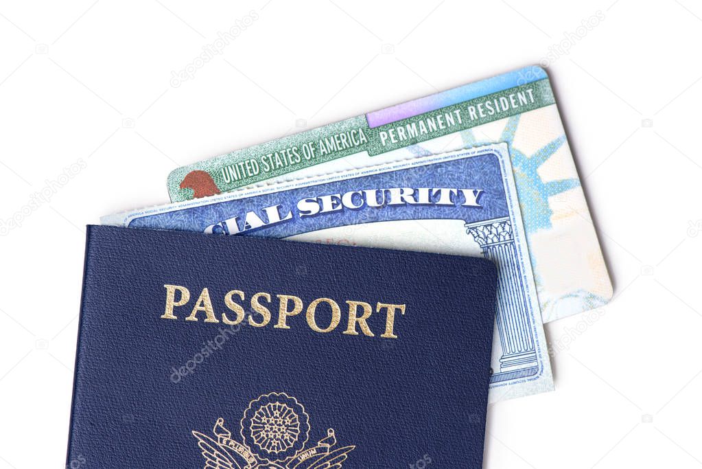 United States passport, social security card and resident card isolated on white background. Immigration concept