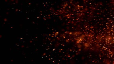 Gece gökyüzündeki büyük ateşten yanan kırmızı kıvılcımlar uçuşuyor. Ateş, ışık ve yaşam teması üzerine çok soyut bir arka plan. Yanan közler siyah arkaplan üzerinde uçan parçacıklar.