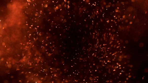 熱い赤い火花が夜空の大きな火から飛びます 光と生活のテーマに美しい抽象的な背景 黒い背景の上に粒子を飛び散らせて — ストック写真
