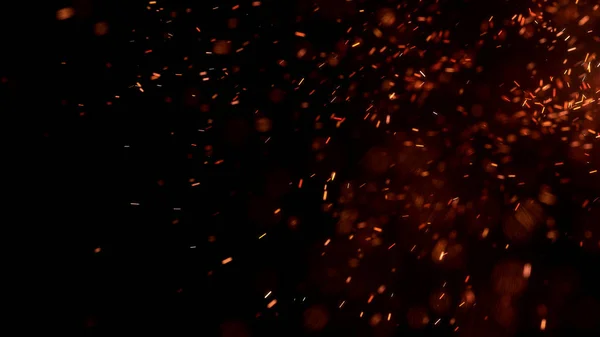 Gece gökyüzündeki büyük ateşten yanan kırmızı kıvılcımlar uçuşuyor. Ateş, ışık ve yaşam teması üzerine çok soyut bir arka plan. Yanan közler siyah arkaplan üzerinde uçan parçacıklar.