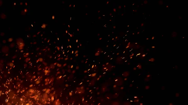 Gece gökyüzündeki büyük ateşten yanan kırmızı kıvılcımlar uçuşuyor. Ateş, ışık ve yaşam teması üzerine çok soyut bir arka plan. Yanan közler siyah arkaplan üzerinde uçan parçacıklar.